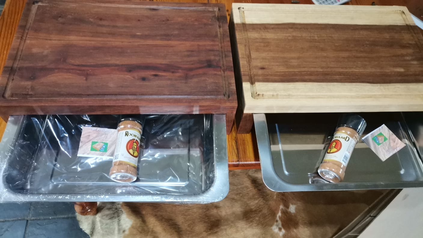 Two handmade boards showing natural variations in the kiaat grain